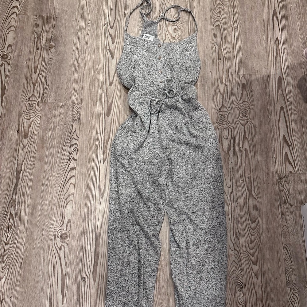 OUT FROM UNDER GREY JUMPSUIT